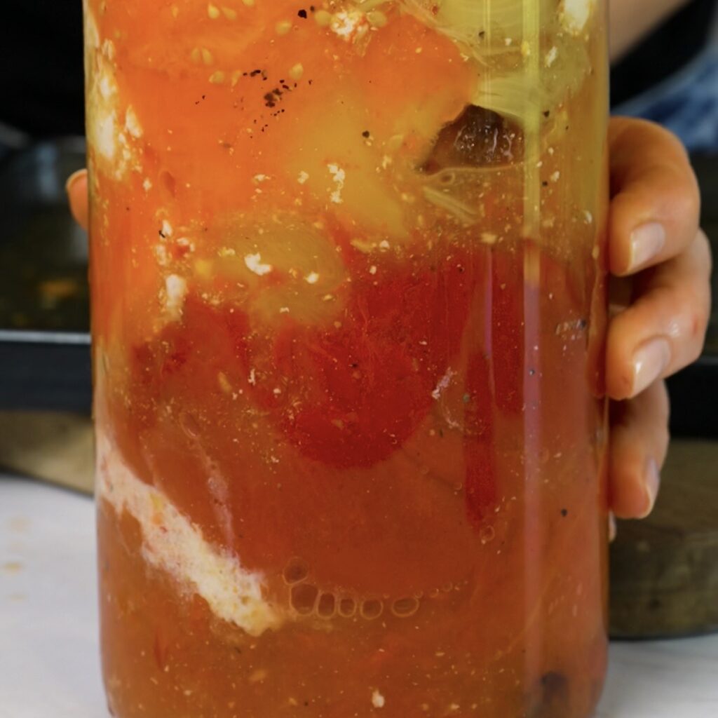 Blending roasted tomatoes, bell pepper, garlic and ricotta into a smooth pasta sauce.