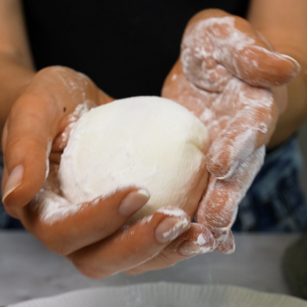 Dusting Cherry Rice Paper Mochi with cornflour and icing sugar