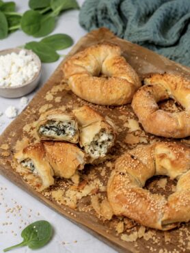 Feta and Spinach Filo Doughnuts served on a wooden board