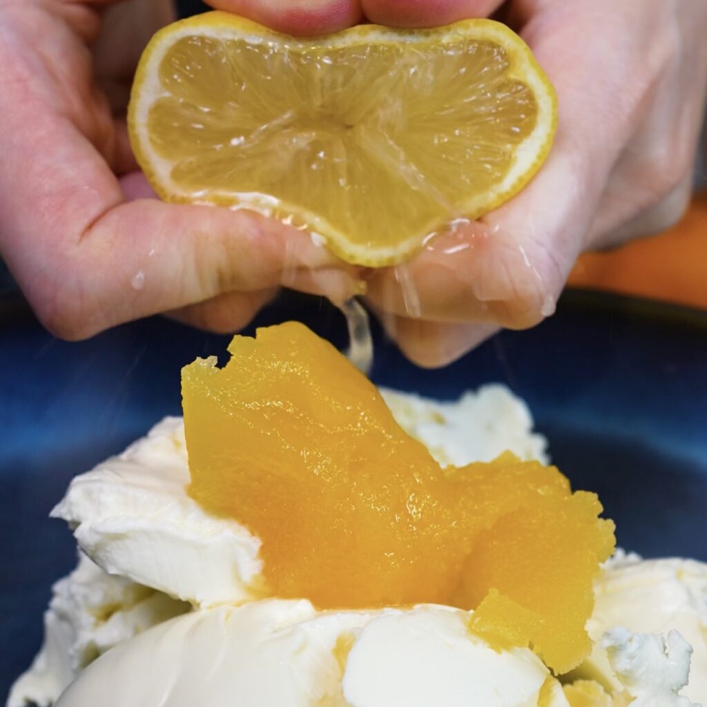 Mascarpone, cream cheese, honey and lemon juice in a bowl before mixing for Apricot Mascarpone Puffs