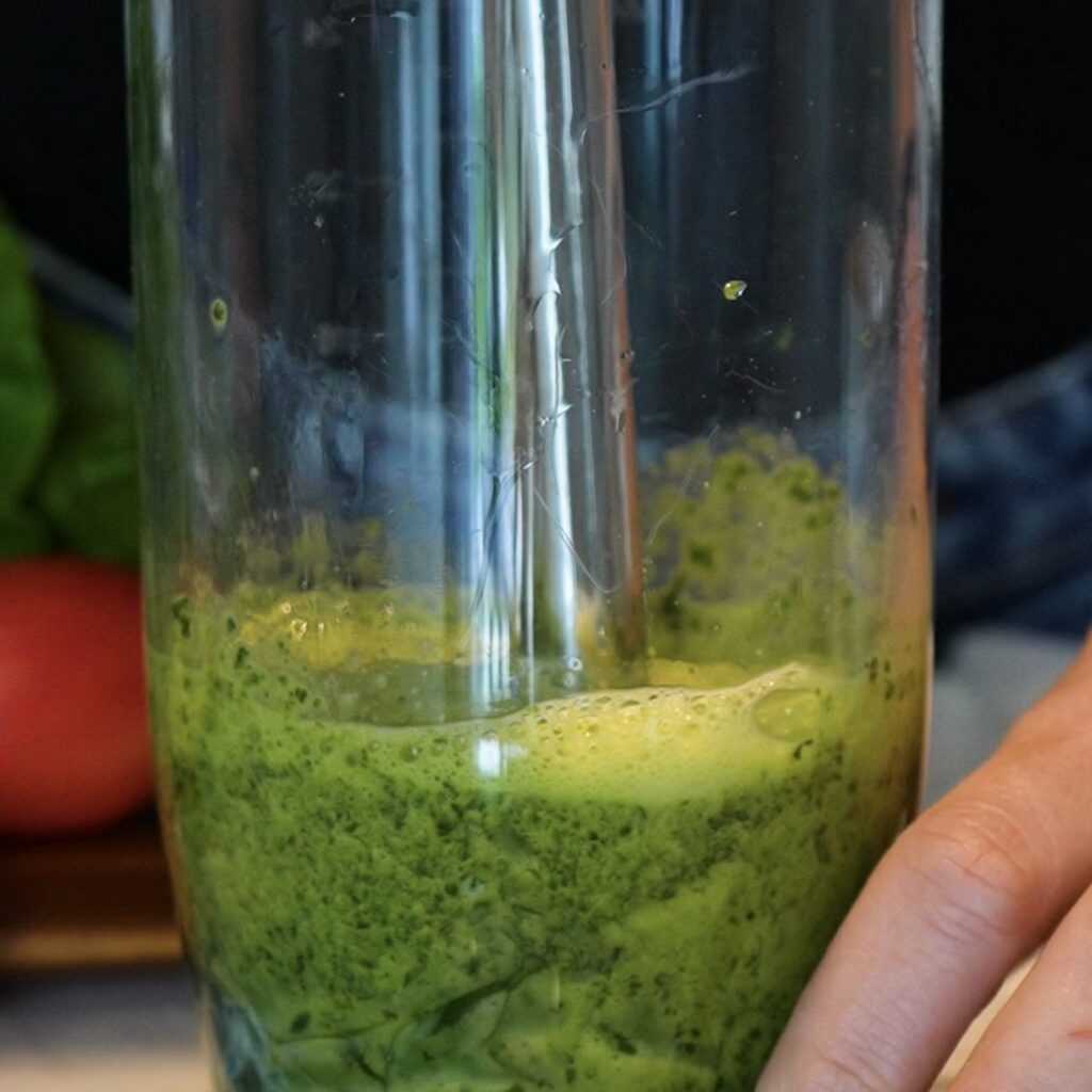 Blending spinach and eggs for High-Protein Spinach Sandwich