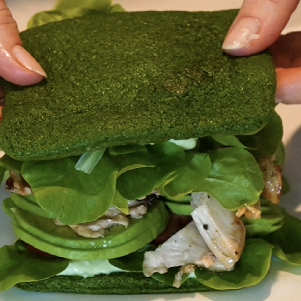 Assembling High-Protein Spinach Sandwich with chicken, avocado and vegetables