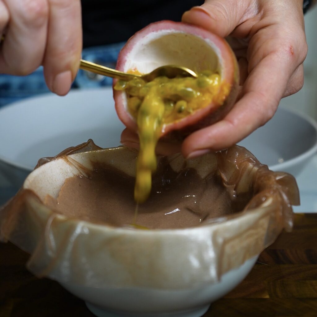 Passion fruit flesh and seeds added to the centre of the chocolate protein filling.