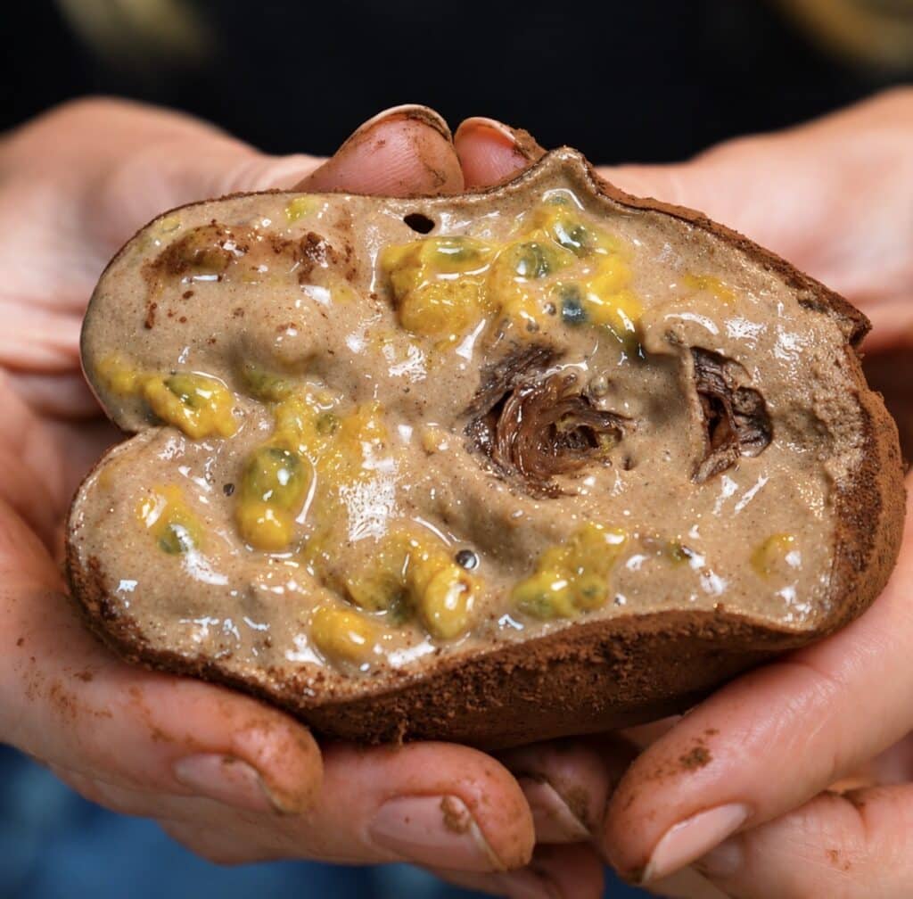 High-Protein Chocolate Rice Paper Mochi cut in half to reveal the creamy chocolate filling and passion fruit centre.