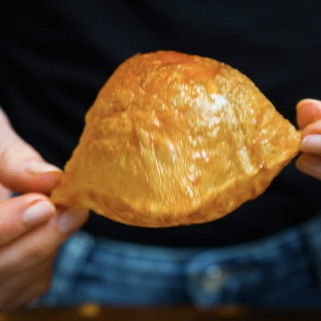 Golden puffed rice paper tart case straight from the air fryer.