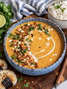 Roasted Sweet Potato Soup served in a bowl with rice.