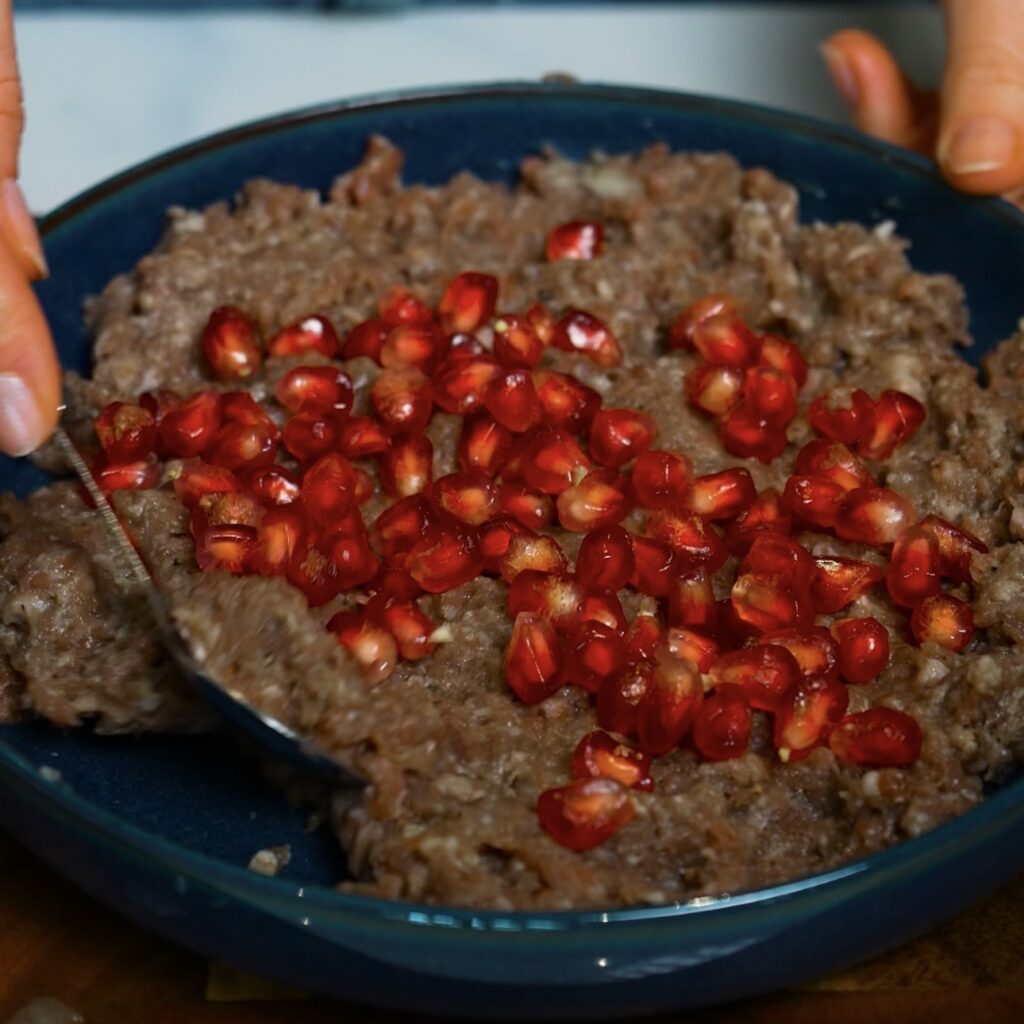 Pomegranate seeds added to minced beef filling for Azerbaijani Qutab