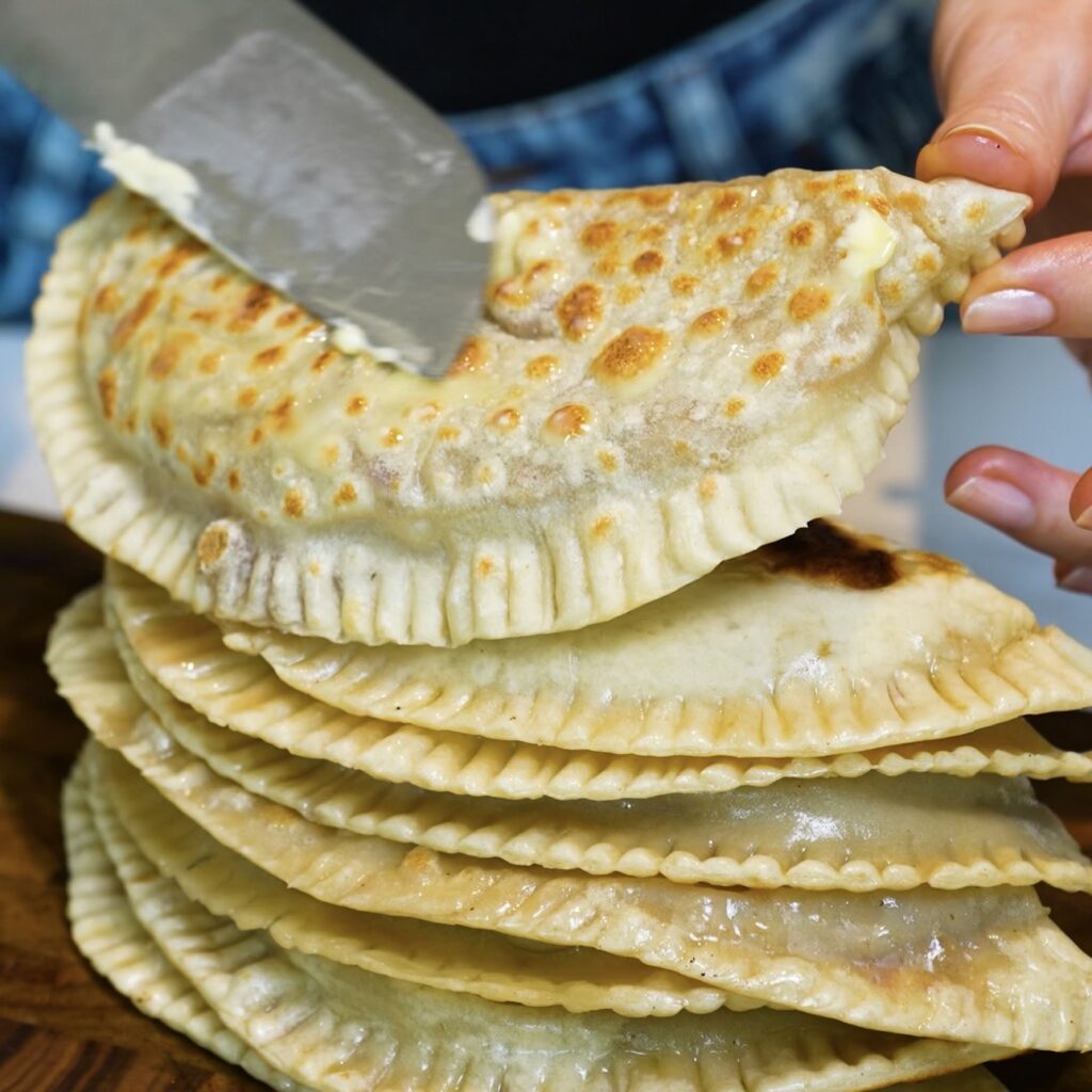Brushing Azerbaijani Qutab with melted butter