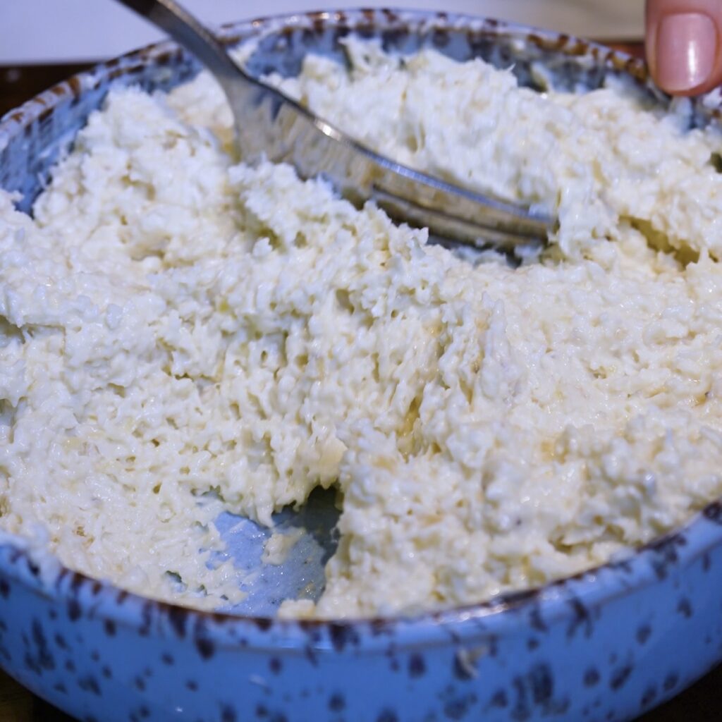Mixing bananas, yoghurt, desiccated coconut and vanilla in a bowl for Banana Coconut Truffles