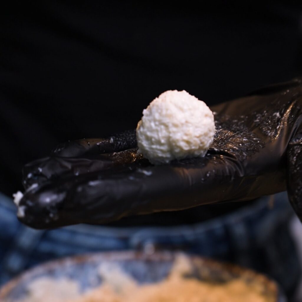 Shaping a ball from the slightly frozen banana coconut mixture